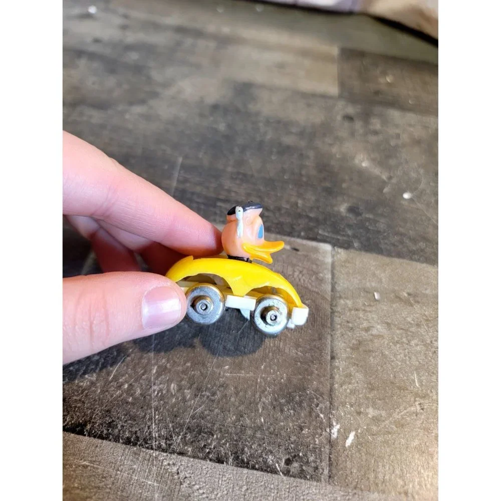 Vintage Donald Duck‎ yellow mini car Disney toy figure